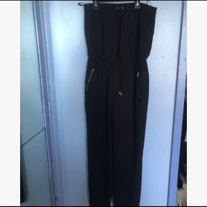 Full length, black jumpsuit